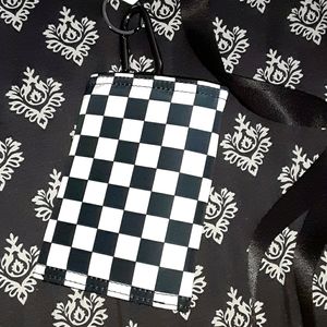 I am selling a black and white checkered wallet